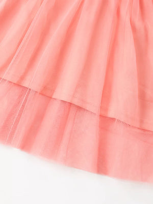 Coral pink baby dress with layered tulle skirt detail
