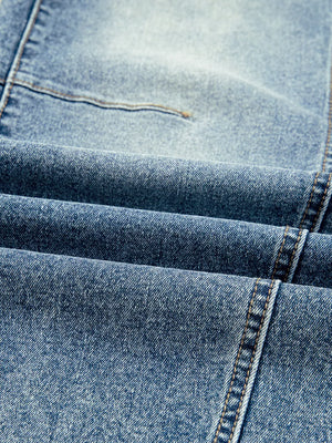 Light wash denim maternity jeans with visible seams and stitching detail.