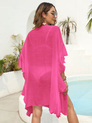 Hot Pink beach kimono with cascading ruffles and open sides, made of 100% polyester.
