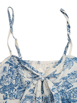 Blue floral tie-front cami top with adjustable straps and a sweetheart neckline.