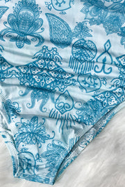 Light blue one-piece swimsuit with intricate blue geometric and paisley print