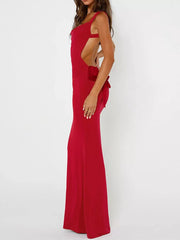 Red backless maxi dress with bow detail and square neckline.