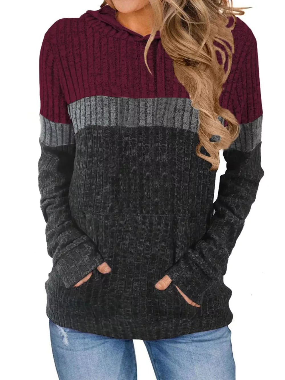 Color block ribbed knit hoodie in burgundy, gray, and black with thumbholes and pockets.