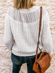 Cream ribbed knit pullover sweater with lace yoke detail and long sleeves.