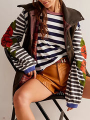 Striped long sleeve tee with embroidered floral detail on sleeves.