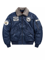Dark blue bomber jacket with embroidered patches and faux fur collar.