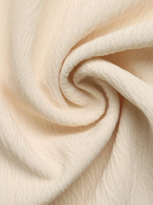 Cream pleated V-neck strapless romper fabric detail