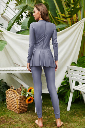 Dark Gray long sleeve swimsuit with flounce hem and leggings.