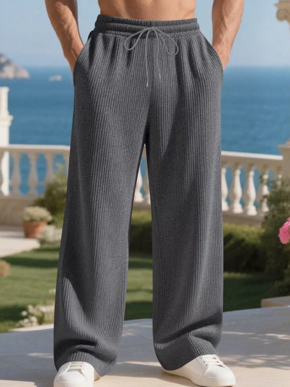 Men's dark gray ribbed drawstring sweatpants with a relaxed fit.