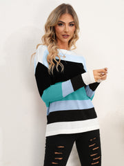 Colorblock crewneck sweater with horizontal stripes in black, teal, and light blue acrylic knit.