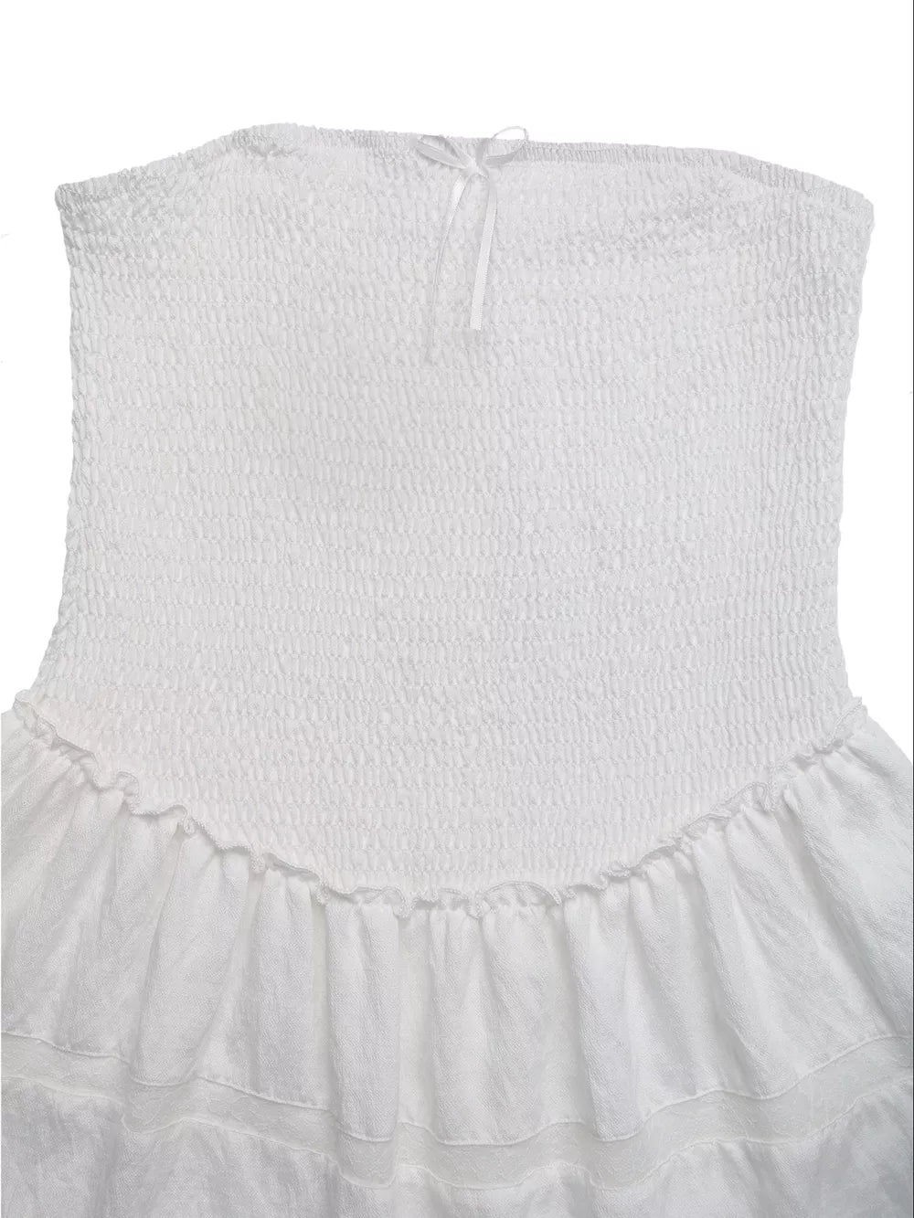 White smocked strapless mini dress with eyelet hem and bow detail