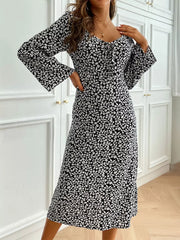 Floral print midi dress with flare sleeves and a tie-neck detail.