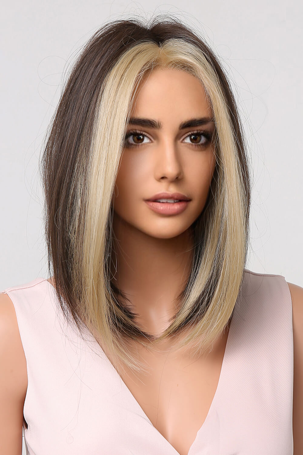 Two-tone bob wig in brown and blonde money piece style, framing the face.