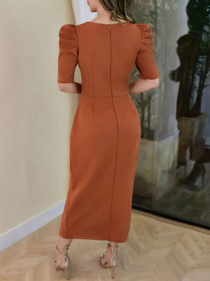 Orange cotton bodycon midi dress with puff sleeves and a back zipper.