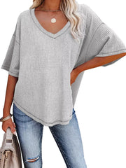 Grey waffle knit relaxed v-neck t-shirt with short sleeves and contrast stitching detail.