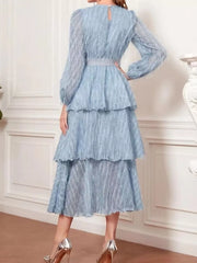 Sky blue tiered midi dress with balloon sleeves and defined waist.