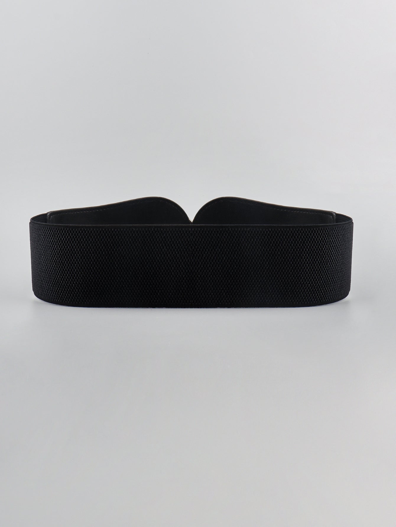 Black elastic waist cincher belt with sculpted detail and textured fabric.