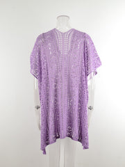Lavender open-knit V-neck beach cover-up with short sleeves and a floral pattern.