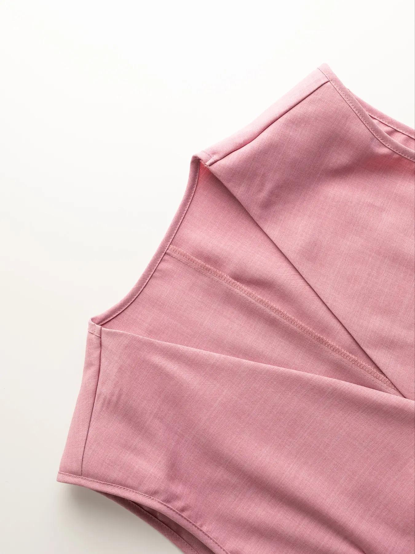 Pink relaxed blazer shorts set detail showing notched lapel and seam detail.