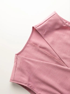 Pink relaxed blazer shorts set detail showing notched lapel and seam detail.