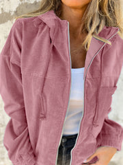 Dusty pink corduroy relaxed fit zip-up hoodie with drawstring hood and pockets.