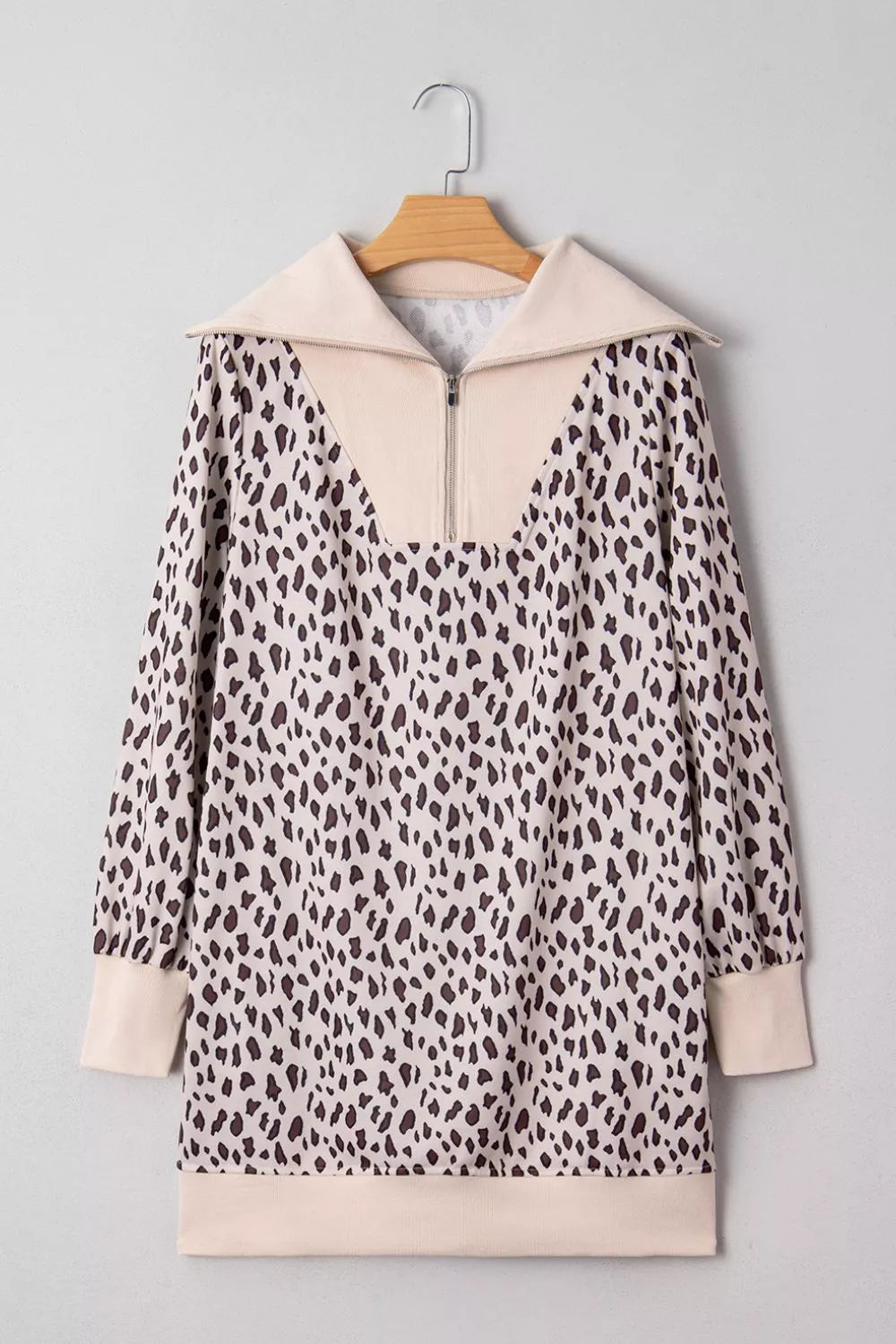 Leopard print cotton mini dress with zip-up collar and long sleeves.