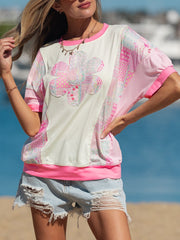 Floral patchwork relaxed t-shirt with crew neck and pink trim.