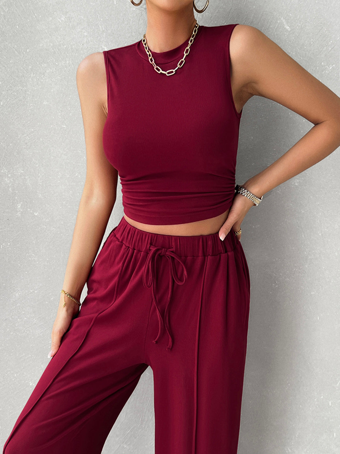 Burgundy ribbed sleeveless crop top and drawstring wide-leg lounge pants set.