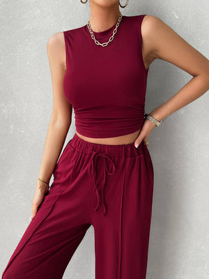 Burgundy ribbed sleeveless crop top and drawstring wide-leg lounge pants set.