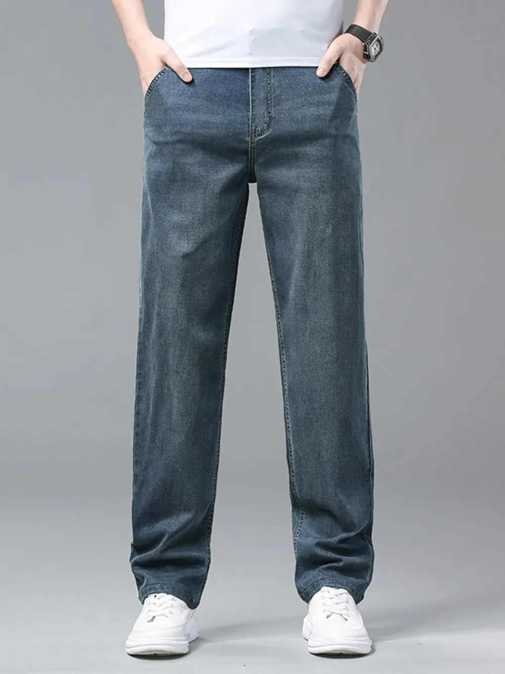 Relaxed fit washed blue sweatpants with a comfortable casual style.