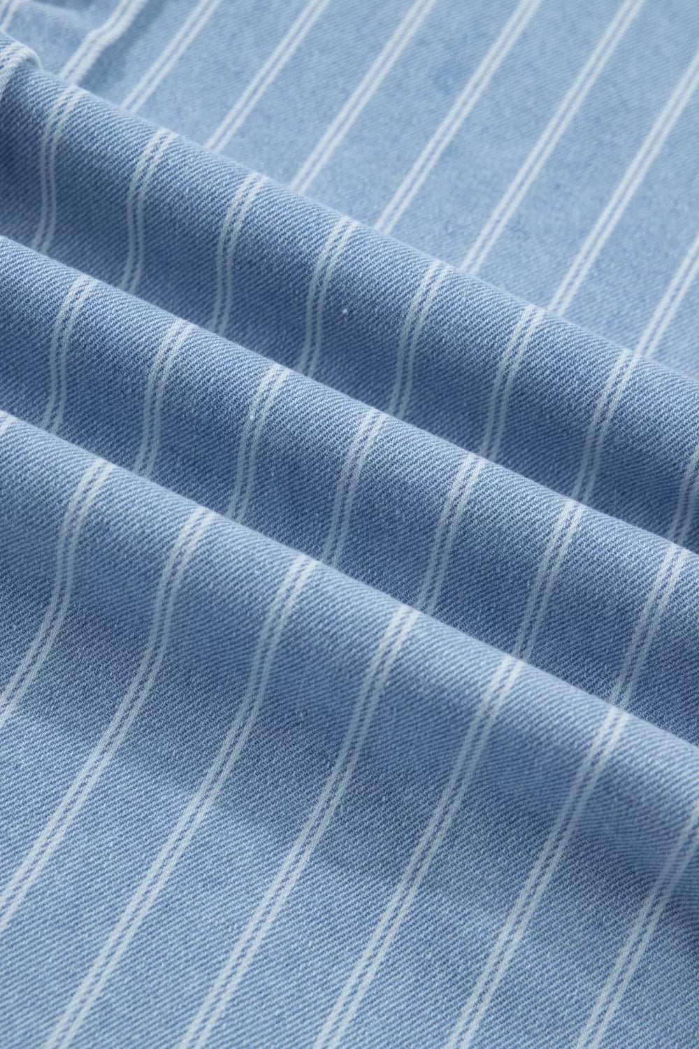Denim mini dress with vertical white pinstripes and a textured weave.