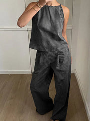 Black striped sleeveless top and wide-leg pants set with a halter neckline.