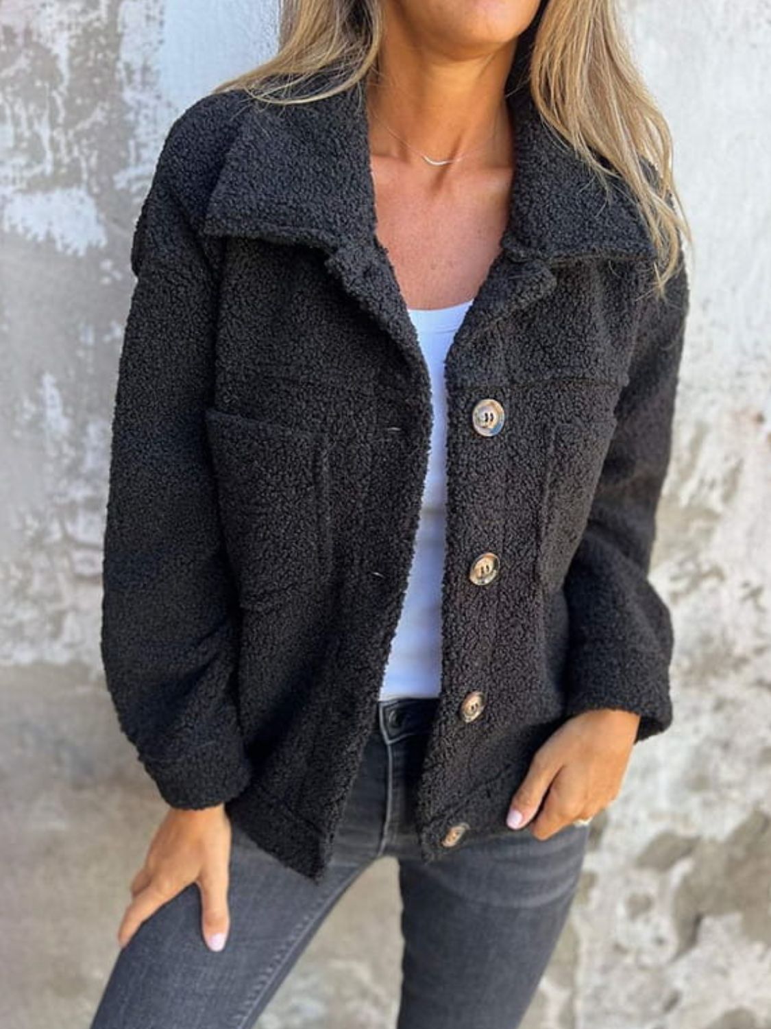 Black textured sherpa utility jacket with button front and chest pocket detail.