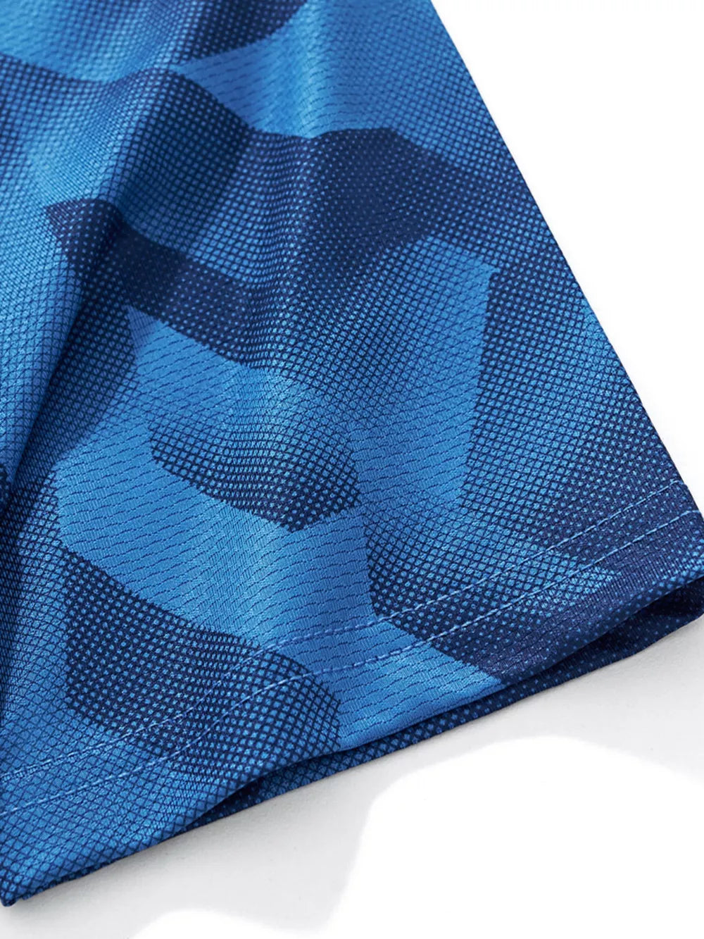 Boys' dark blue geometric print t-shirt with breathable fabric detail.