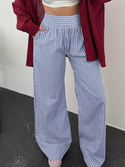 Blue gingham smocked high-waist wide-leg pants with pockets.