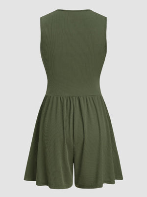 Textured ribbed plunge romper in army green with a cinched waist and flared shorts.