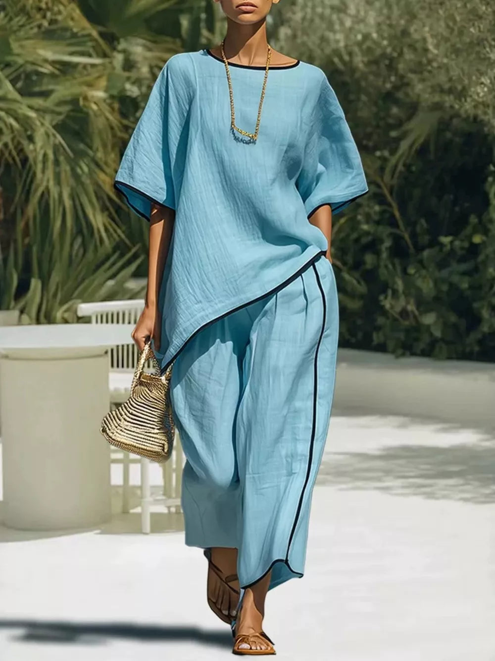 Sky blue two-piece set with contrast trim, half sleeves, and wide-leg pants.