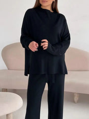 Black relaxed fit knit co-ord set with a mock neck top and drawstring pants.