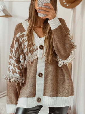 Brown acrylic houndstooth cardigan with white trim and fringe details.