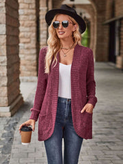 Burgundy textured ribbed open-front cardigan with pockets, styled with a white tank and jeans.