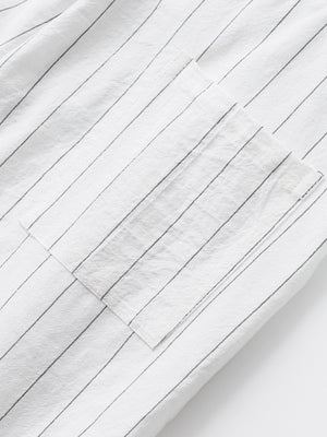 White striped sweatpants with a pocket detail.