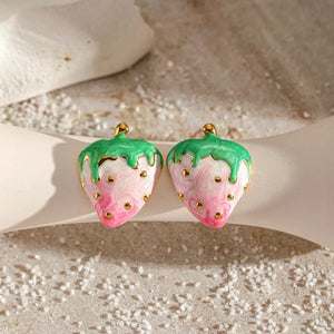 18k gold strawberry charm earrings with pink and white marbled enamel and green tops.