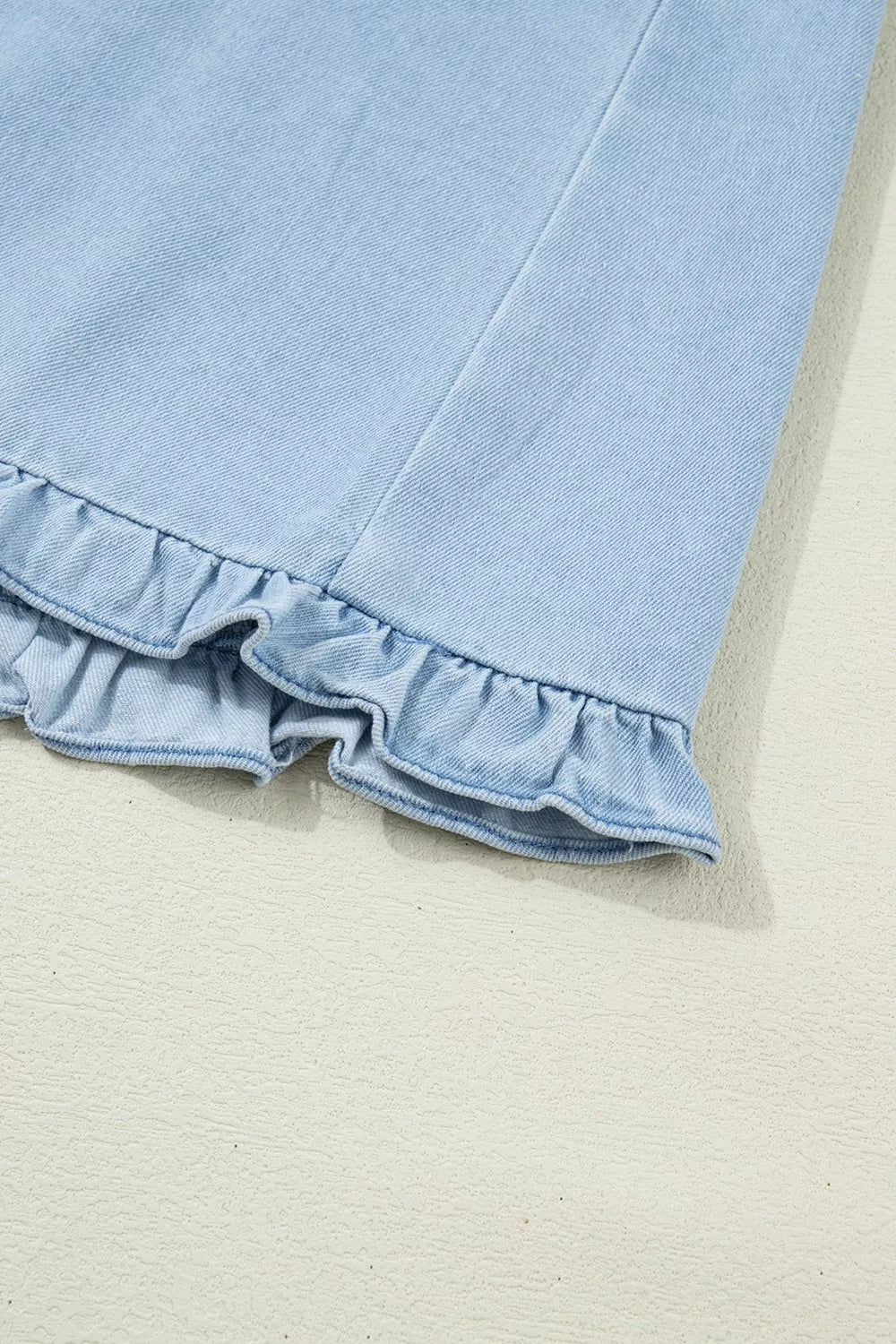 Light blue denim shift dress with ruffled hem detail