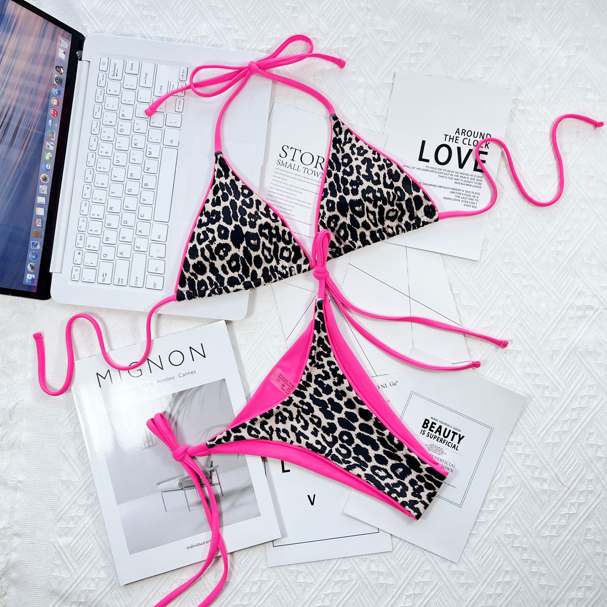 Leopard print tie-side bikini set with hot pink trim and ties.