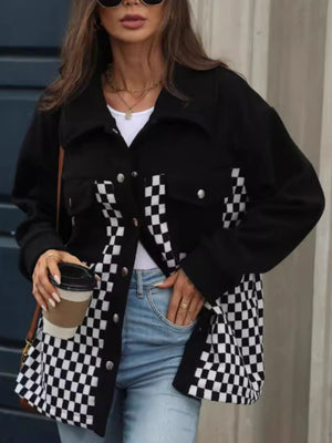 Black button-up jacket with checkerboard panels and silver buttons.