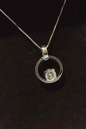 Silver moissanite halo circle pendant necklace on a box chain, made of 925 sterling silver.