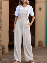 Corduroy wide-leg overalls in Dust Storm with tie straps and button accents.