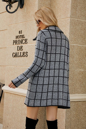 Grid-print knit blazer coat in gray with black lines, featuring a lapel collar and long sleeves.