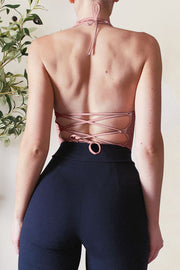 Watermelon pink halter crop top with lace-up back detail.