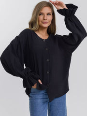 Black textured blouse with puff sleeves and ruffled cuffs, button-down front.
